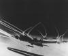 B-17 Flying Fortresses of the 390th Bomb Group, US Eighth Air Force, accompanied by escort fighter aircraft, leave vapour trails in the sky, 23 November 1943. Handwritten caption on reverse: 'Single most famous aerial combat photo. B-17F Plane 'F'. 27 Sept 1943. Raid against Emden, 17th Combat mission of 390BG.'