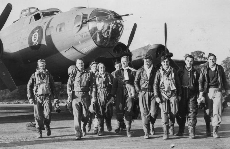 A bomber crew of the 390th Bomb Group return to base after a mission in their B-17 Flying Fortress nicknamed 